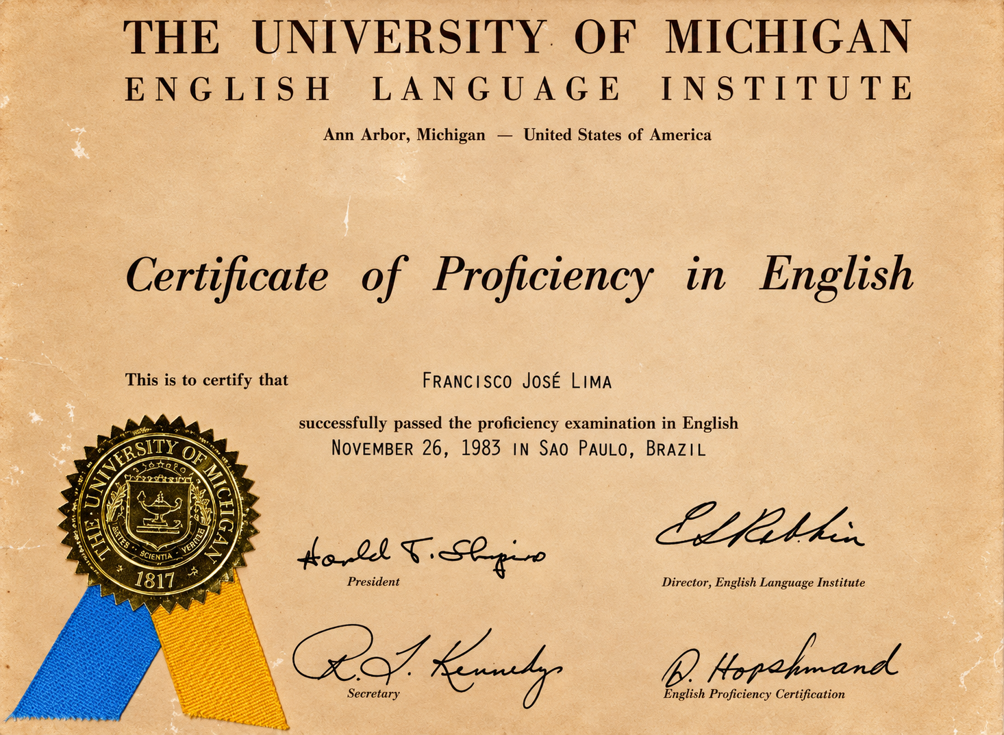 Certificado de proficiência em inglês da Universidade de Michigan, em nome de Francisco José de Lima. O documento tem um selo e assinaturas.